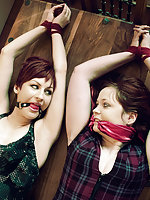 Two girls roped together and gagged